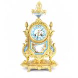 An early 20th century French-style gilt metal mantel clock, the porcelain dial set with Roman