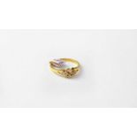 An 18ct gold ring set with four diamonds, stamped 750, size O, approx. 2.8g.