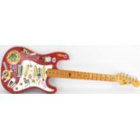 MARLIN; a vintage electric guitar in red, with later stickers, serial no. 907276 (lacking strings).