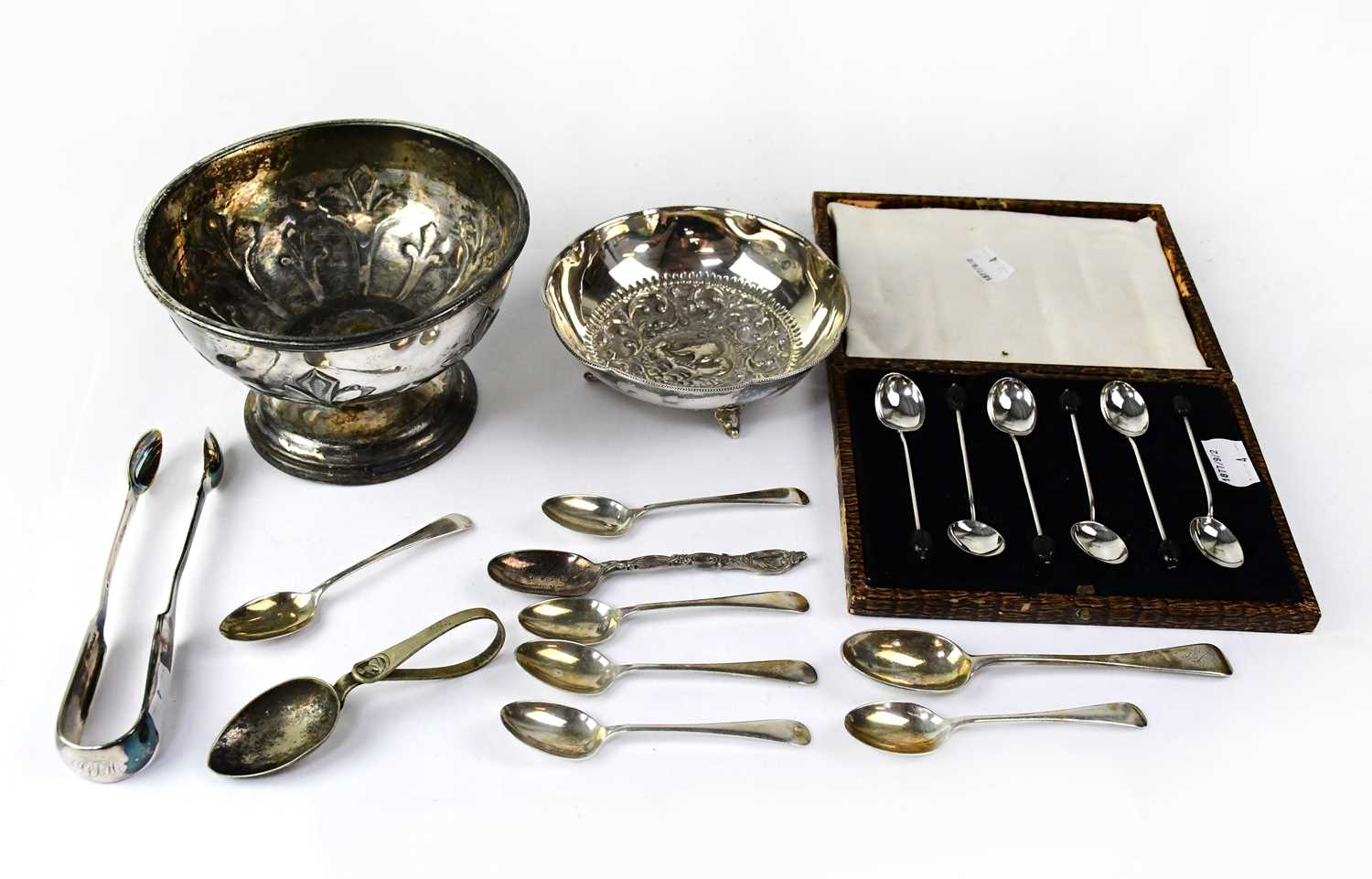 A cased of hallmarked silver coffee bean spoons, a set of five hallmarked silver mismatched