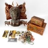 A group of Indonesian carved figures to include female figures, decorative jewellery box, warthog,