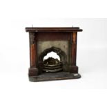 An Edwardian miniature mahogany stained and metal fire surround and grate, 29 x 29cm.