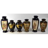Six Japanese Satsuma and other vases, comprising a pair of Satsuma baluster vases with panel figural