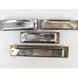 Four harmonicas to include Hohner Marine Band No.365, BJ Blues, Puretone and one other (4).