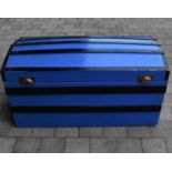A vintage wooden steamer trunk with black slat top sides and later painted blue body, 50 x 99 x