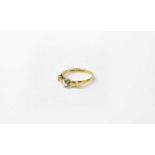 An 18ct gold solitaire diamond ring in a contemporary setting, stamped 18, size O, approx. 3.4g.
