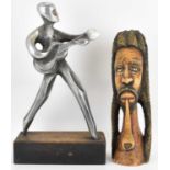 A cast aluminium sculpture of a guitar player, mounted on a wooden base, unsigned, height 42cm, base