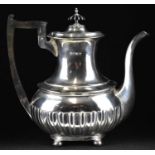 An Edwardian hallmarked silver teapot with ebonised handles and knop, Walker & Hall, Sheffield 1901,