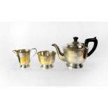 An Elizabeth II hallmarked silver three-piece tea service comprising teapot, sugar bowl and milk