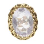 A 9ct gold dress ring with oval cut claw set lilac stone, in cage mount, size Q, approx. 6.4g.