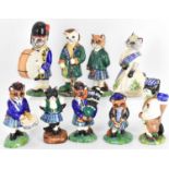LOMOND CERAMICS, SCOTTISH; nine ceramic cat figures, all dressed in a Scottish theme, to include '