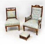 Two walnut framed salon chairs and a similar footstool, all upholstered in pale blue floral