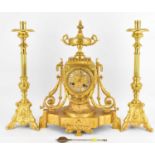 A 20th century French gilt brass clock with vase top, barrel movement with white porcelain Roman