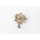 A 9ct gold topaz and diamond set pendant/brooch in the form of a shamrock, stamped 375, approx. 4.