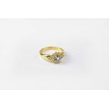 An 18ct gold cluster ring set with topaz and diamonds, stamped 750, size N, approx. 5.7g.Condition