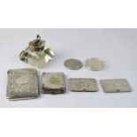A group of hallmarked silver items comprising a card case with scroll decoration, a crystal ink