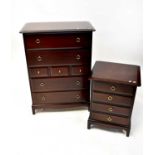 STAGG; a Minstrel pattern mahogany chest of drawers with two long above three short drawers, above
