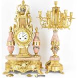A 20th century French striking mantel clock, the gilt metal body in the form of a lyre with eagle