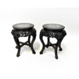 A pair of 20th century ebonised Oriental jardinière stands with grey marble inset tops, 46.5 x