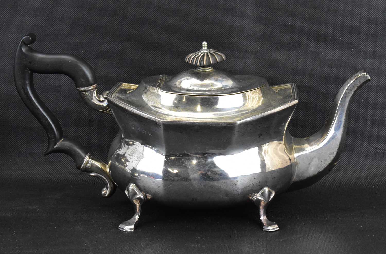 A George V hallmarked silver three-piece tea service with ebonised handle and knop, raised on four - Image 2 of 5