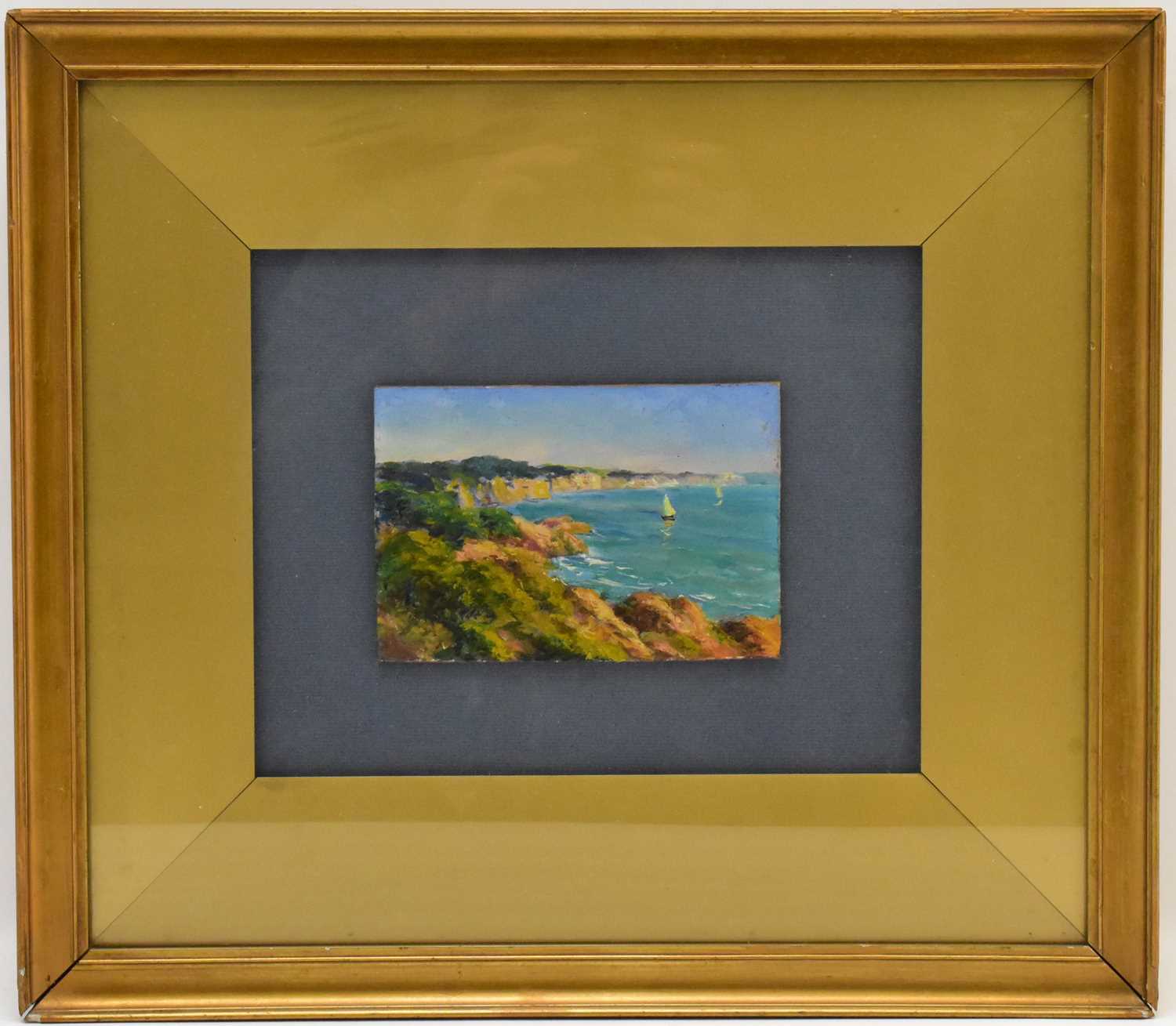 INDISTINCTLY SIGNED (British, 20th century); oil on board, sailboats off coastline, signed lower