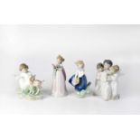 LLADRÓ; three boxed figurines comprising 'Bundle of Blossoms', 'Angels' Group' and 'A Little Child