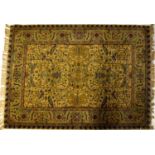 A Persian cream and green ground rug with stylised floral motifs within multi borders, approx. 180 x