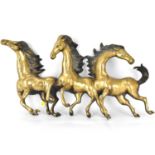 A 20th century large brass wall-hanging display of three galloping stallions, 35 x 69cm.
