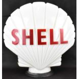 A Shell white glass petrol pump globe by Hailware, with red lettering and black rubber seal to the