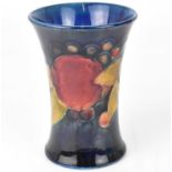 MOORCROFT; a small tube-lined waisted vase, 'Pomegranate' pattern on blue ground, 11 x 7.5cm, with