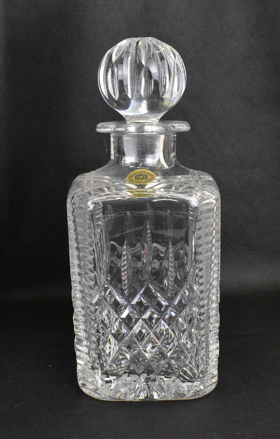 A 20th century mahogany cased three-decanter tantalus, the matching three square English hand made - Image 4 of 4