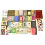 A large quantity of vintage and older playing cards, card games and advertising playing cards to