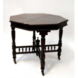 A Victorian mahogany octagonal occasional table with reeded turned and block stretchered supports