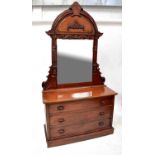 A large reproduction mahogany dressing chest, the arched pediment with gadrooned edge above bevelled