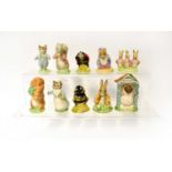 ROYAL ALBERT; ten Beatrix Potter figures to include 'Benjamin Bunny Sat on a Bank', 'Lady Mouse Made