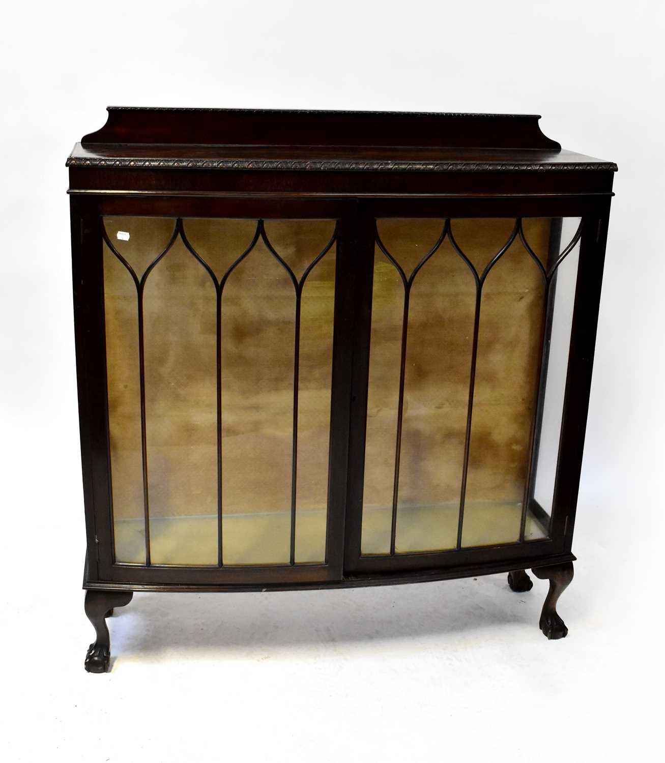 An early 20th century mahogany display cabinet with astragal glazed doors and glass side panels,
