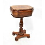 A Victorian rosewood teapoy, the rectangular top with canted corners and gadrooned rim, with