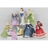 ROYAL DOULTON; seven porcelain figures comprising HN21110 'Christmastime', HN2345 'Clarissa', HN3754