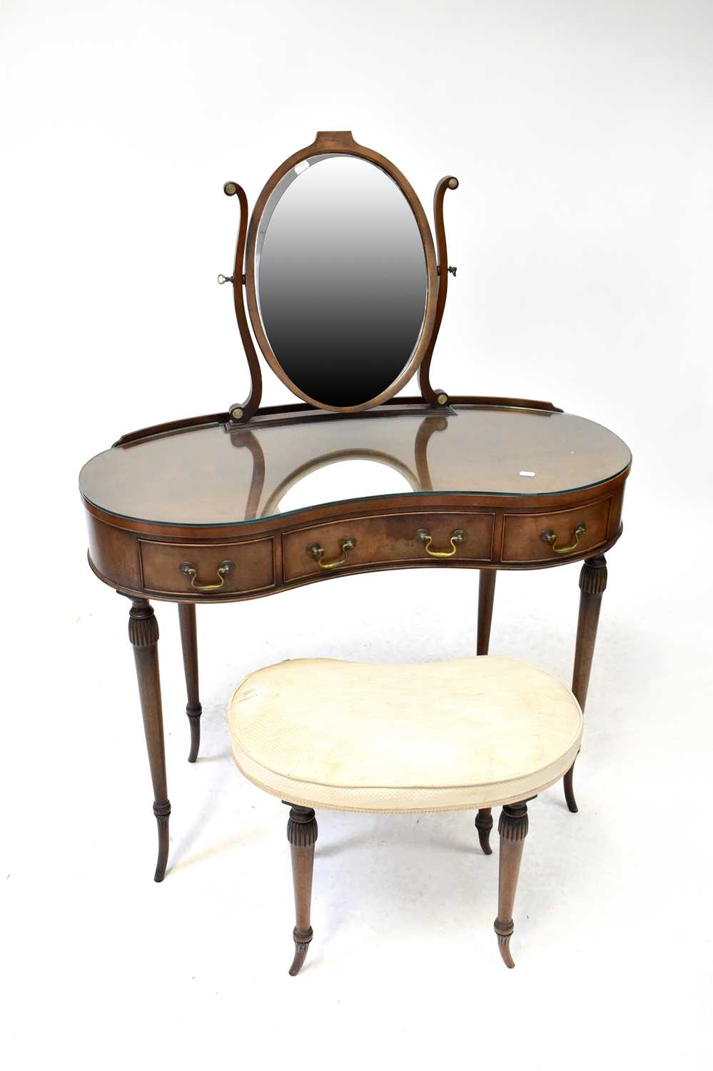 A reproduction mahogany kidney-shaped dressing table with fitted swing mirror, 128 x 97 x 43cm,