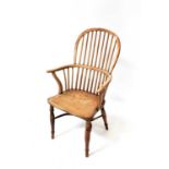 A Georgian yew wood Windsor chair with comb back and crinoline stretcher, height 103cm.Condition