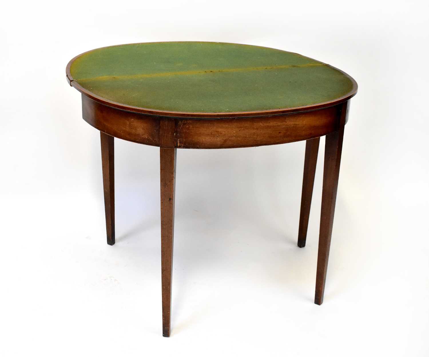 A George III mahogany demi-lune fold-over card table with green baize top, 75 x 91 x 45cm (when