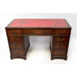 A Georgian-style mahogany pedestal desk with red leather insert top, on bracket feet, 75 x 122 x