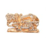 A large flat wooden sculpture of a decorated Indian elephant, on wooden base, height 64cm, base