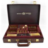 BESTECKE SOLINGEN; a seventy-piece gold plated cutlery set in a leather-style briefcase, over two