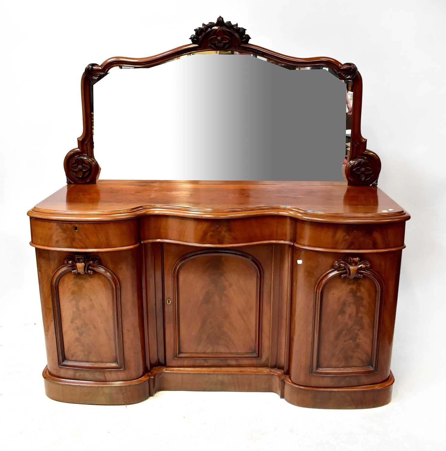 A Victorian mahogany serpentine-fronted mirror back chiffonier sideboard, on plinth base, 179 x