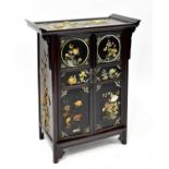 A 20th century Oriental hardwood cabinet, curved top with twin doors, one interior shelf and three