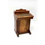 An Edwardian inlaid mahogany davenport with leather insert top, fitted stationery section, on