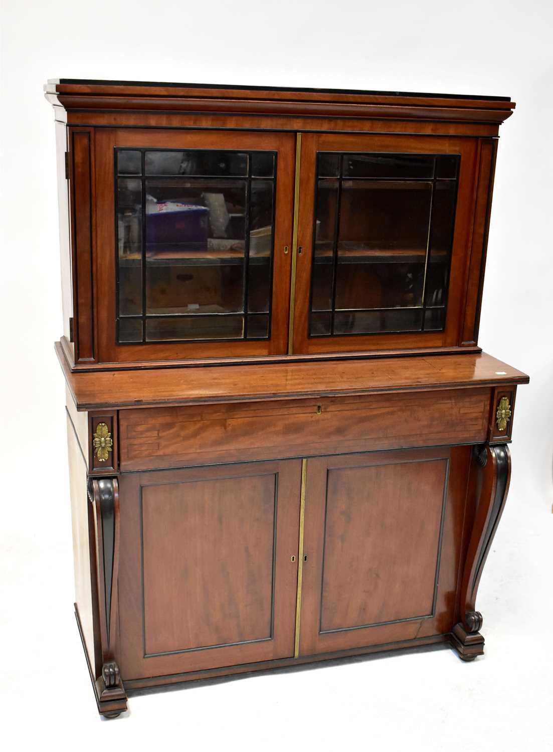 An Edwardian mahogany bureau bookcase of small proportions with twin glazed door to top enclosing an