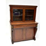An Edwardian mahogany bureau bookcase of small proportions with twin glazed door to top enclosing an