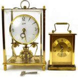 A Kundo brass and glazed cased anniversary clock and a modern Metamec quartz brass cased carriage